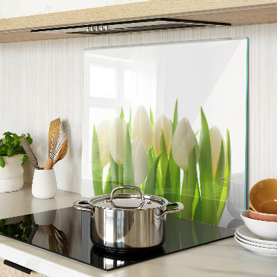 Glass chopping board Tulips against a background of green leaves