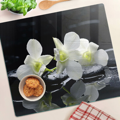Glass chopping board Orchids on a black background