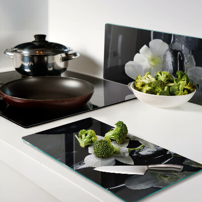 Glass chopping board Orchids on a black background