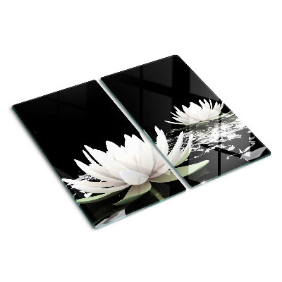 Glass kitchen board Water lilies on a black background