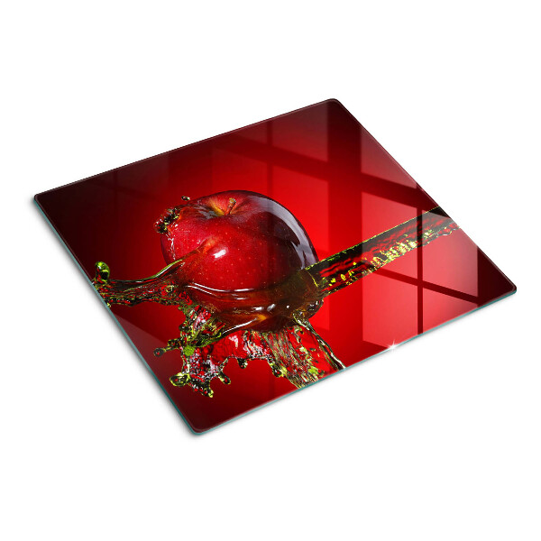 Glass chopping board Red apple with water