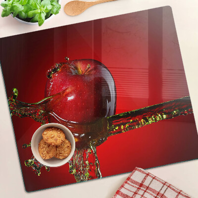 Glass chopping board Red apple with water