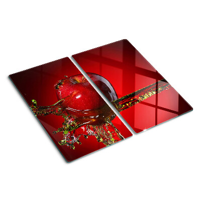 Glass chopping board Red apple with water