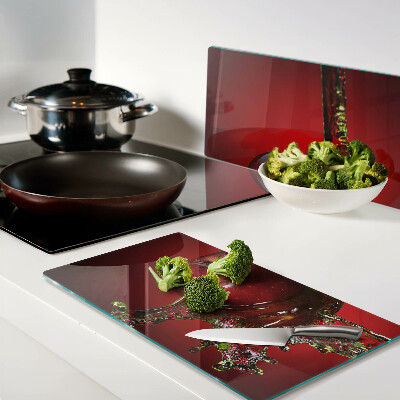 Glass chopping board Red apple with water