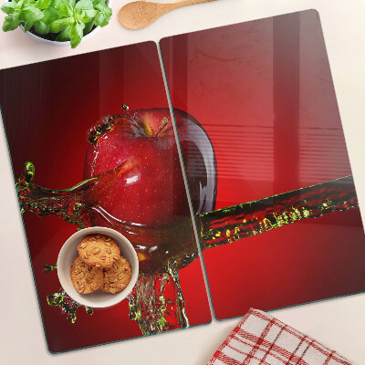 Glass chopping board Red apple with water