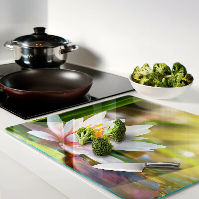 Glass kitchen board Water lily in sunlight