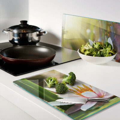 Glass kitchen board Water lily in sunlight