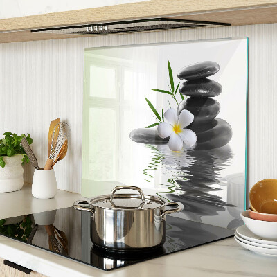 Glass chopping board Flowers and stones on the water