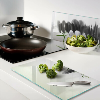 Glass chopping board Flowers and stones on the water