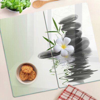Glass chopping board Flowers and stones on the water