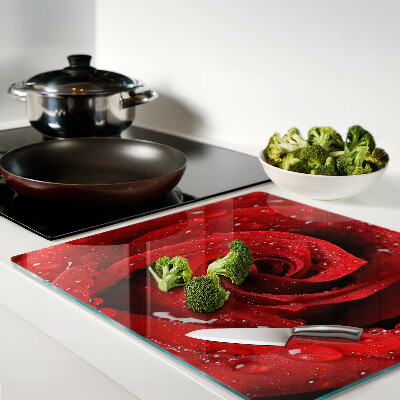 Glass kitchen board Red rose with water drops