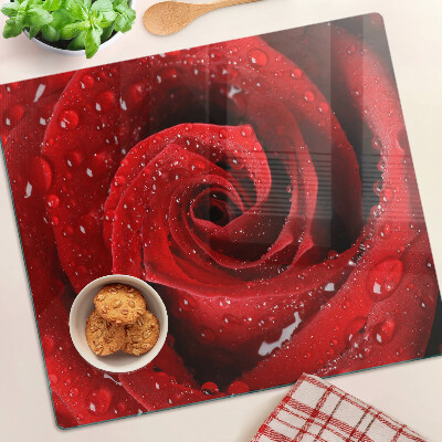 Glass kitchen board Red rose with water drops