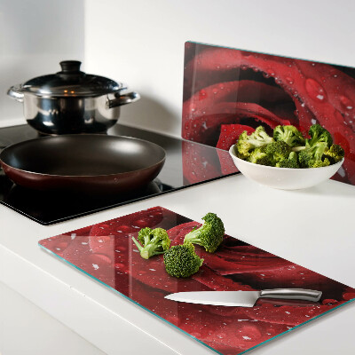 Glass kitchen board Red rose with water drops