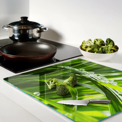 Glass kitchen board Drops of water on the grass
