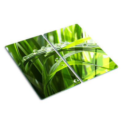 Glass kitchen board Drops of water on the grass