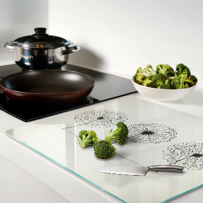 Glass chopping board Dandelions on a white background
