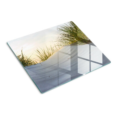 Glass chopping board Green grass against the sky