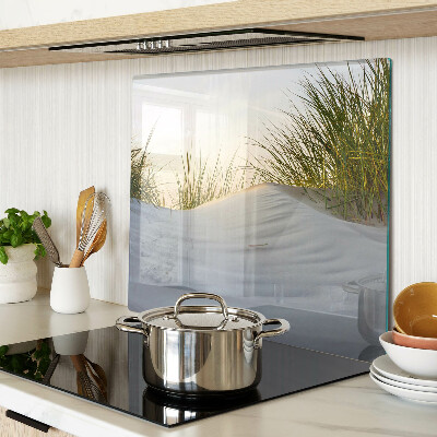 Glass chopping board Green grass against the sky