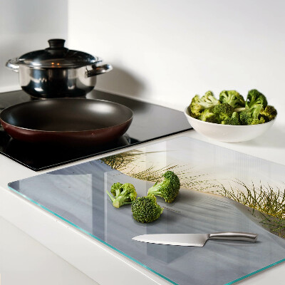 Glass chopping board Green grass against the sky