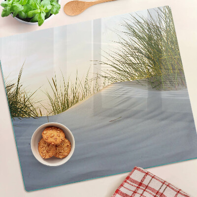 Glass chopping board Green grass against the sky