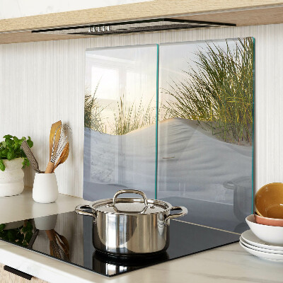 Glass chopping board Green grass against the sky