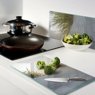 Glass chopping board Green grass against the sky