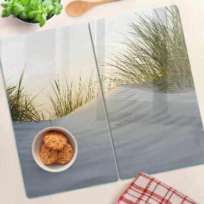 Glass chopping board Green grass against the sky