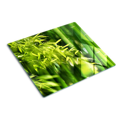 Glass chopping board Bamboo leaves and green foliage