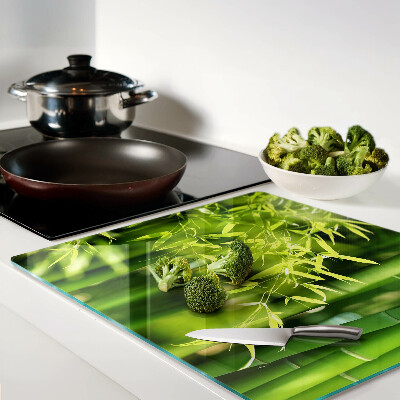 Glass chopping board Bamboo leaves and green foliage