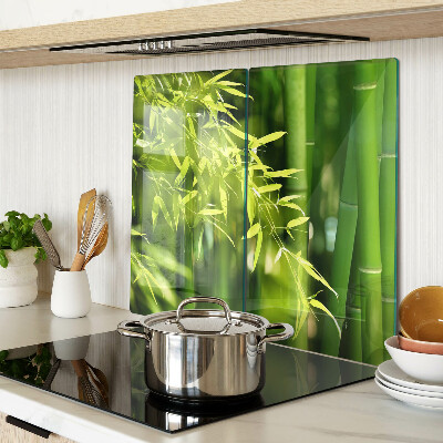Glass chopping board Bamboo leaves and green foliage