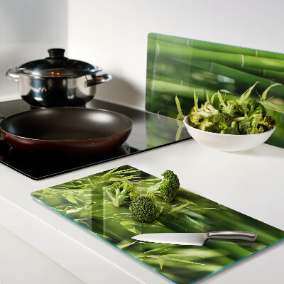 Glass chopping board Bamboo leaves and green foliage