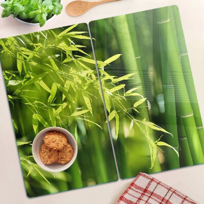 Glass chopping board Bamboo leaves and green foliage