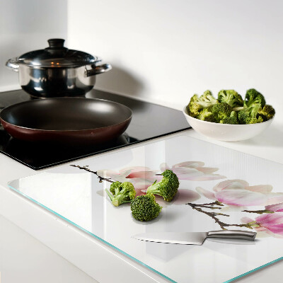 Glass chopping board Magnolia flowers on a branch