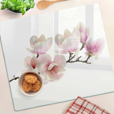 Glass chopping board Magnolia flowers on a branch