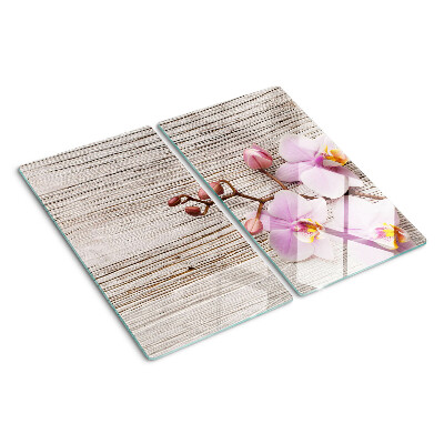 Glass chopping board Orchids on a wood background