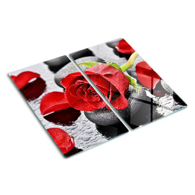 Glass kitchen board Rose on stones with water drops