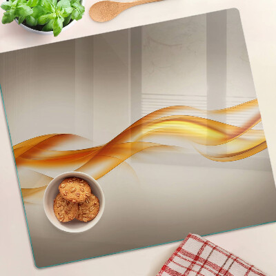 Glass chopping board Waves in shades of gold