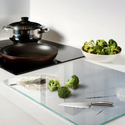 Glass chopping board Dandelions in the background of the window