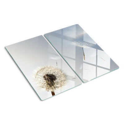 Glass chopping board Dandelions in the background of the window