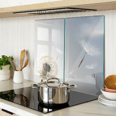 Glass chopping board Dandelions in the background of the window