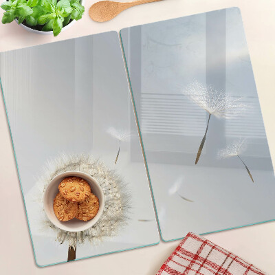Glass chopping board Dandelions in the background of the window