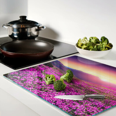 Glass kitchen board Flower landscape at sunset