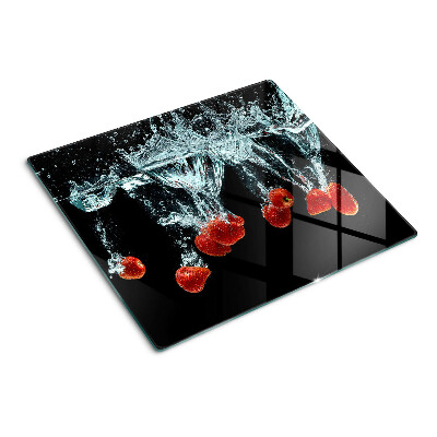 Glass chopping board Strawberries in water