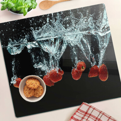 Glass chopping board Strawberries in water