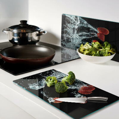 Glass chopping board Strawberries in water