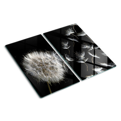 Glass kitchen board Dandelions on a black background
