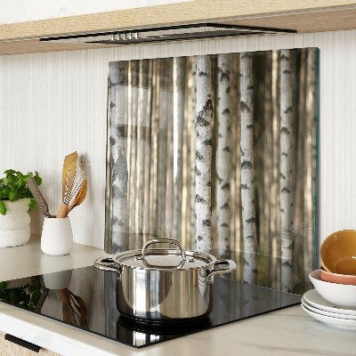 Glass chopping board White birches in the forest
