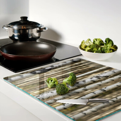 Glass chopping board White birches in the forest
