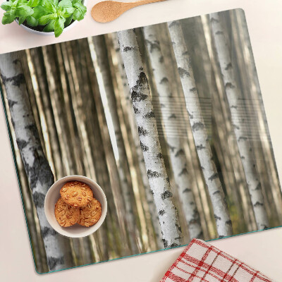 Glass chopping board White birches in the forest