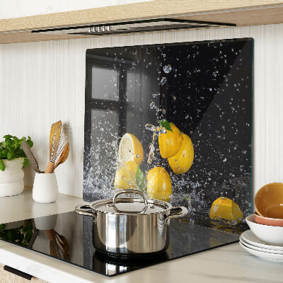 Glass kitchen board Lemons in water